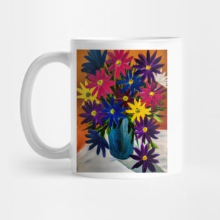 A lovely boutique of abstract vibrant bright colorful  flowers in a tall turquoise glass vase Mug